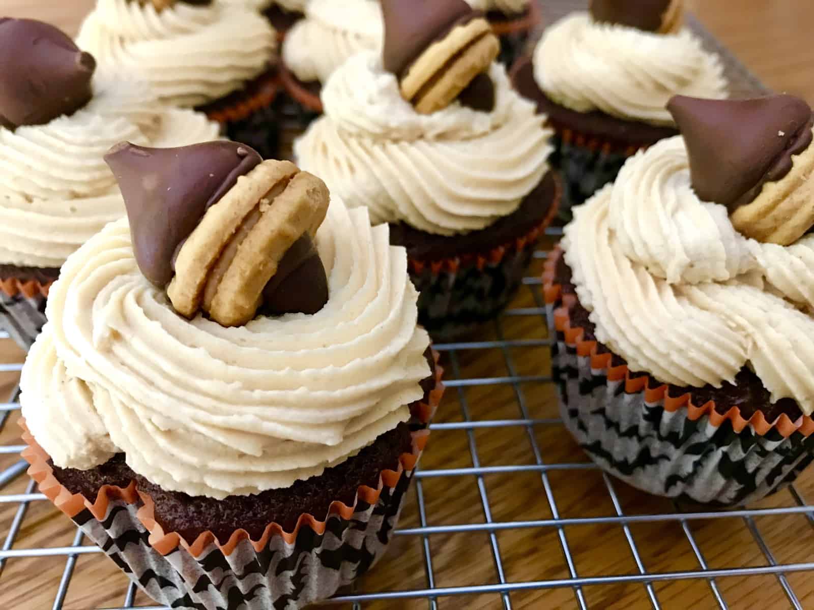 frosted cupcakes on a baking rack