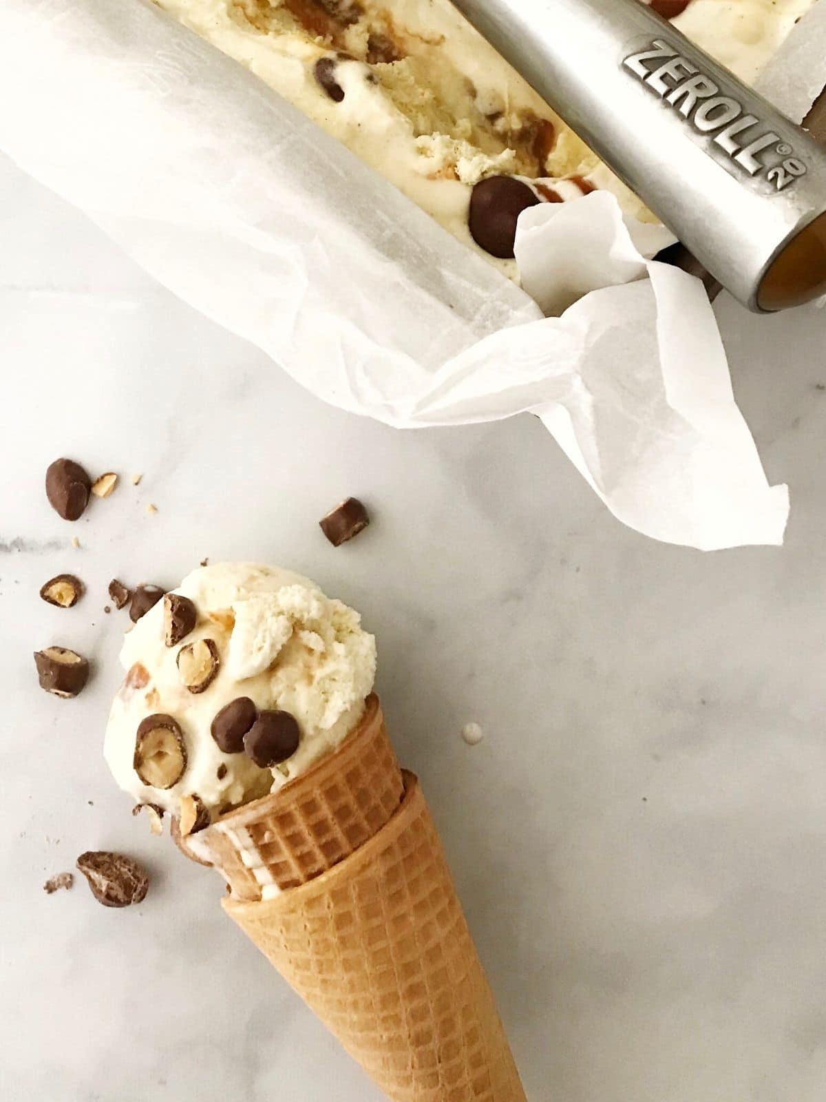 ice cream cone sprinkled with peanuts