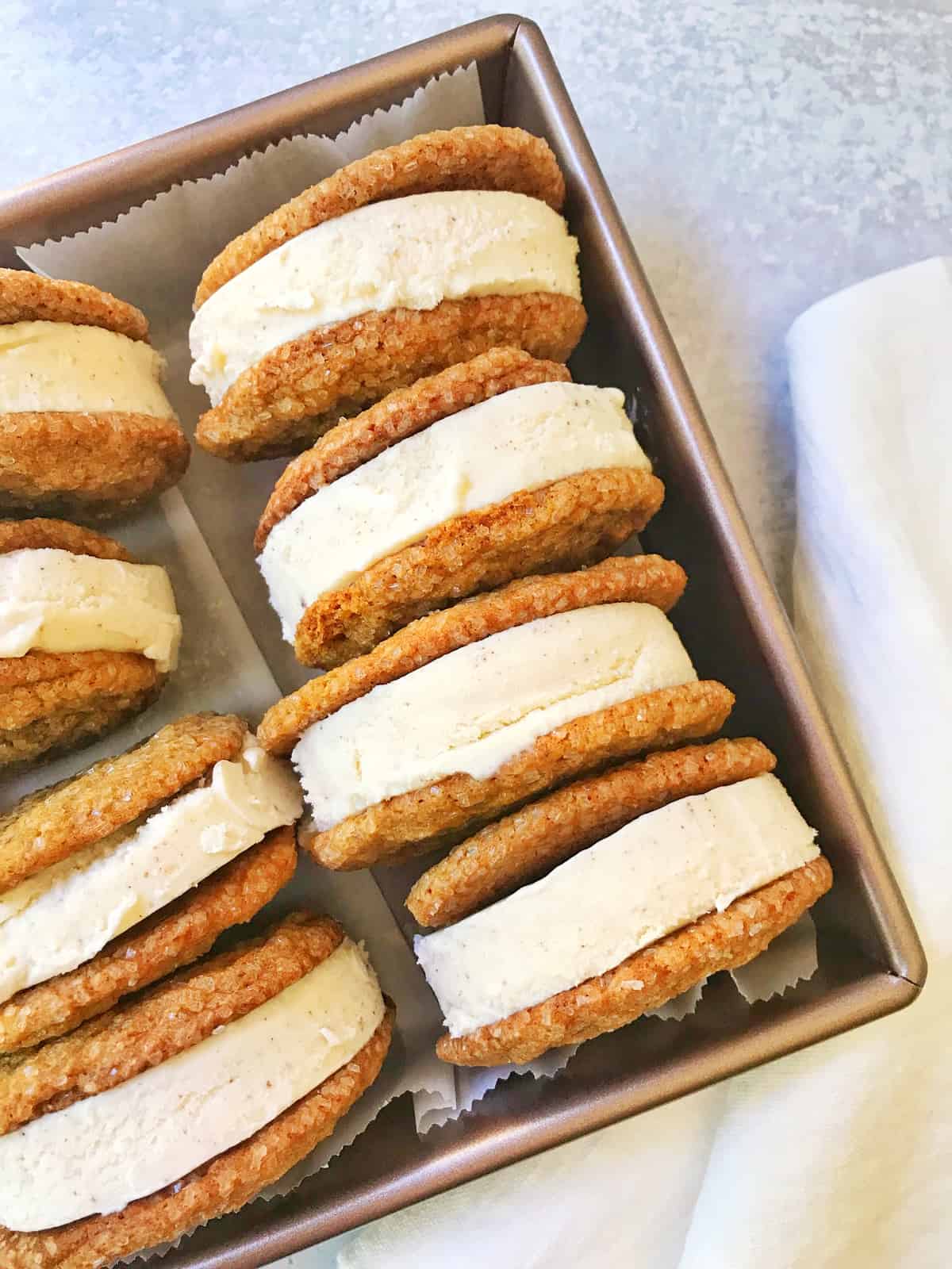 ice cream sandwich cookies in a parchment lined pan