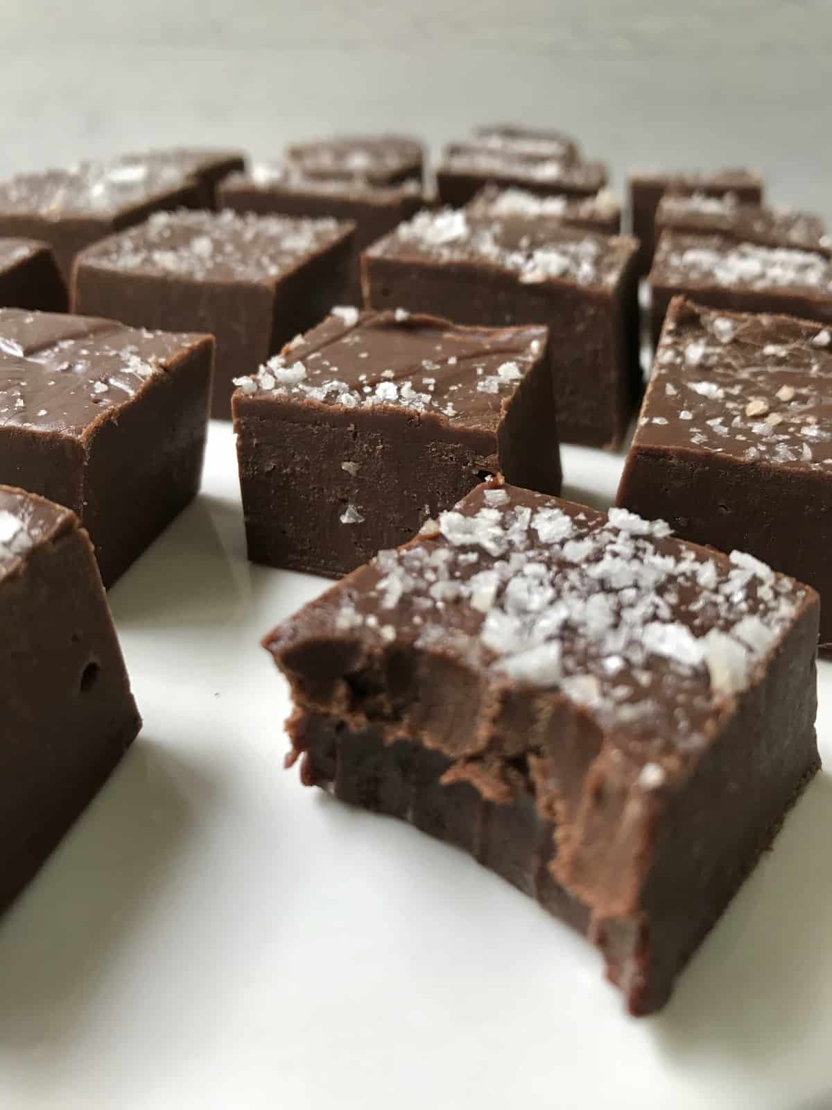 side view of salted fudge on a serving board