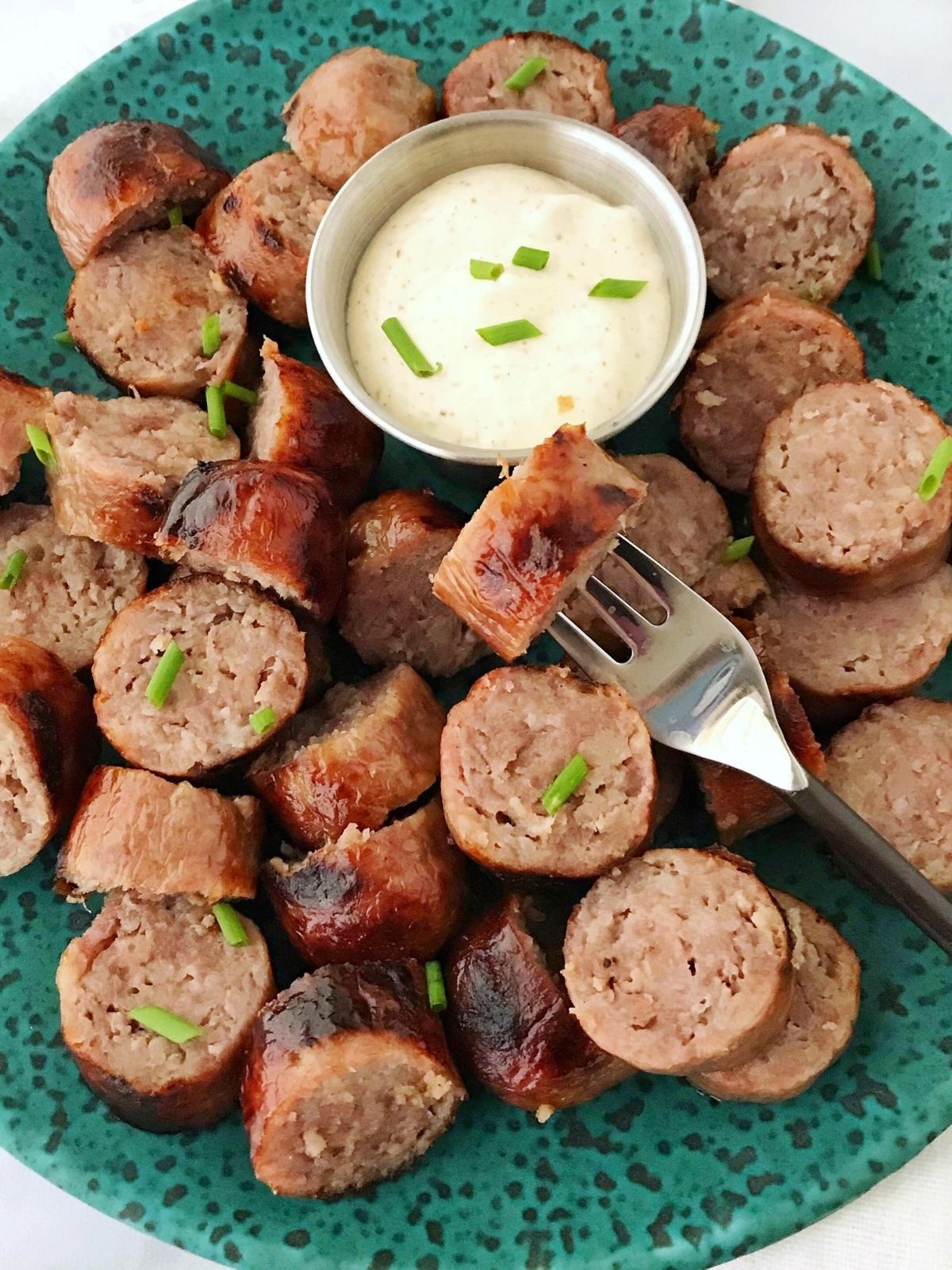 sliced bratwurst with dipping sauce