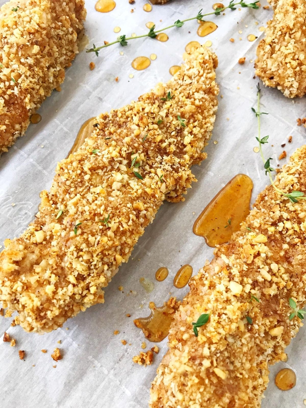 strips of walnut chicken drizzled with honey