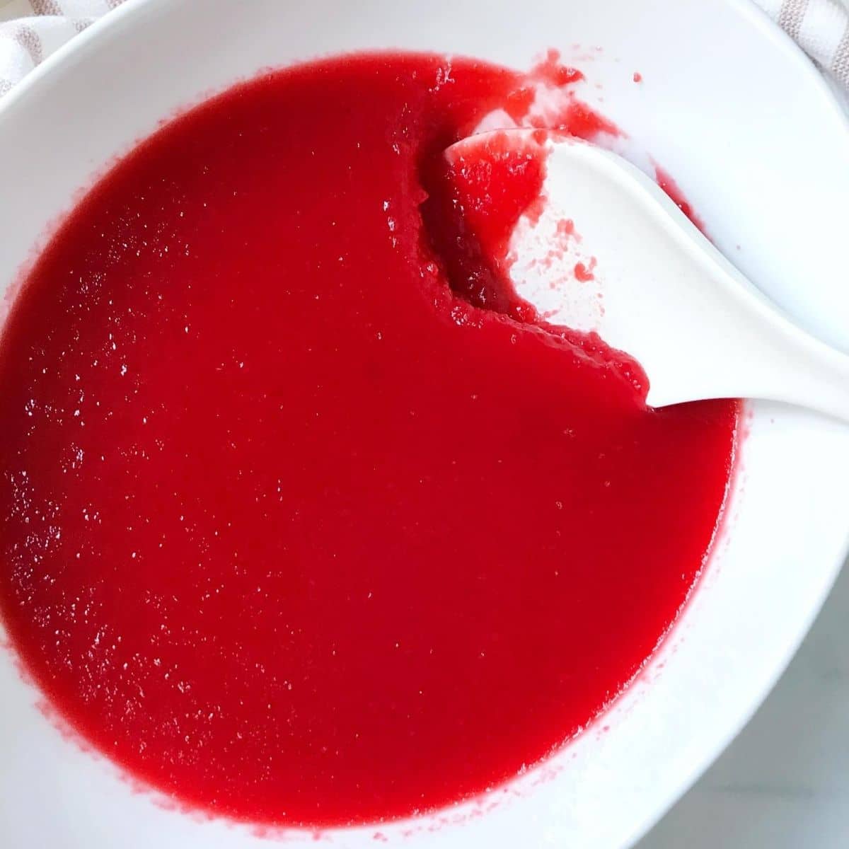 bowl of jello with serving spoon