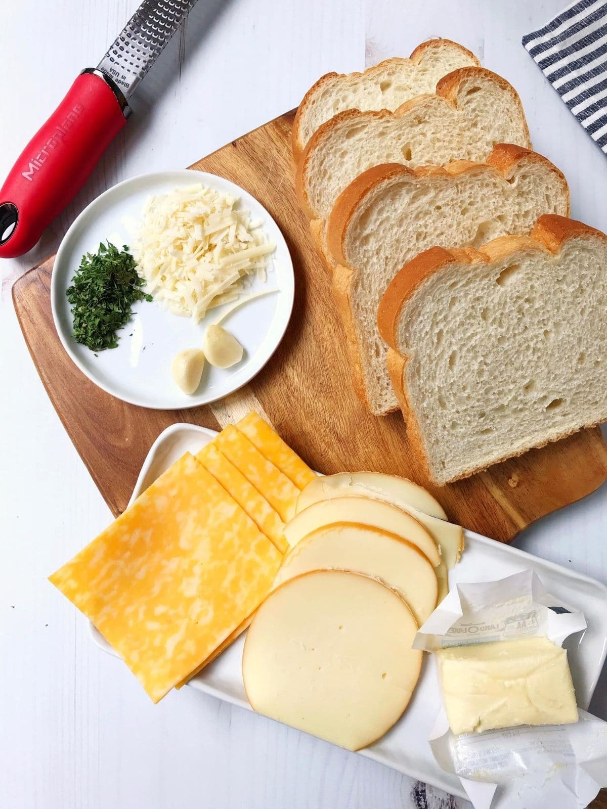 butter and sandwich ingredients on a board