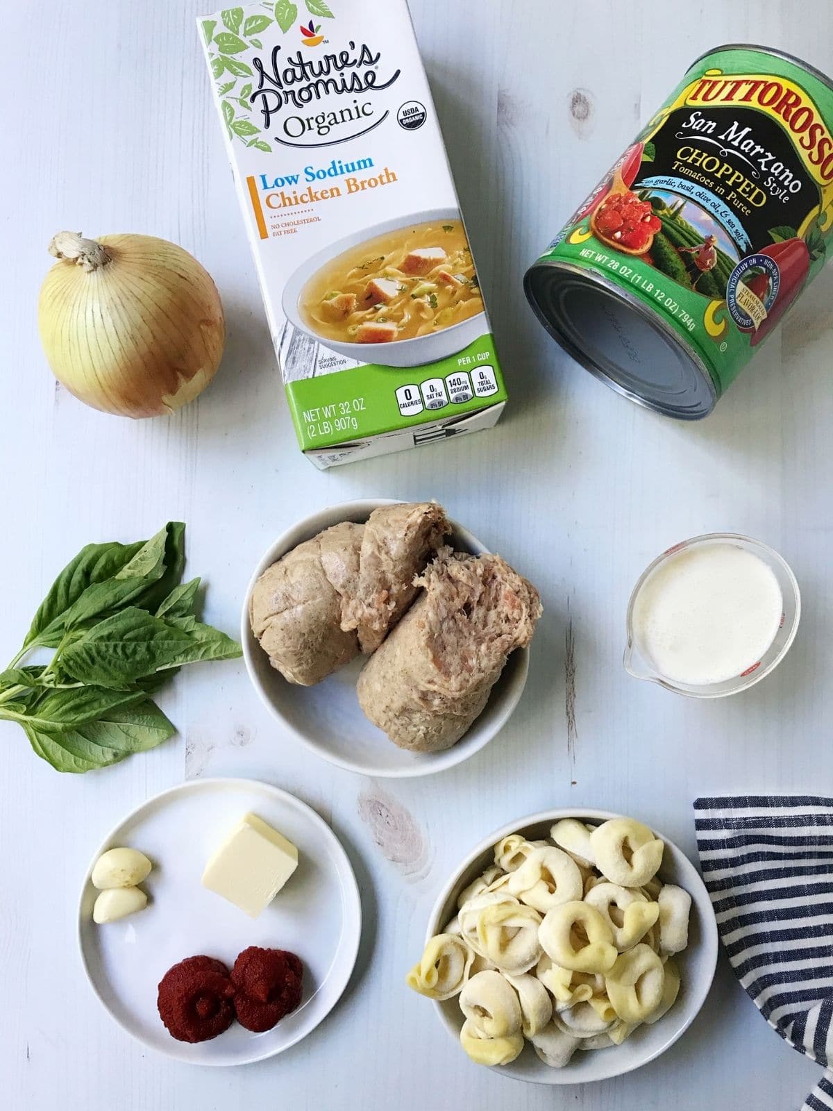 ingredients-sausage, tomatoes, broth, tortellini, cream, seasonings