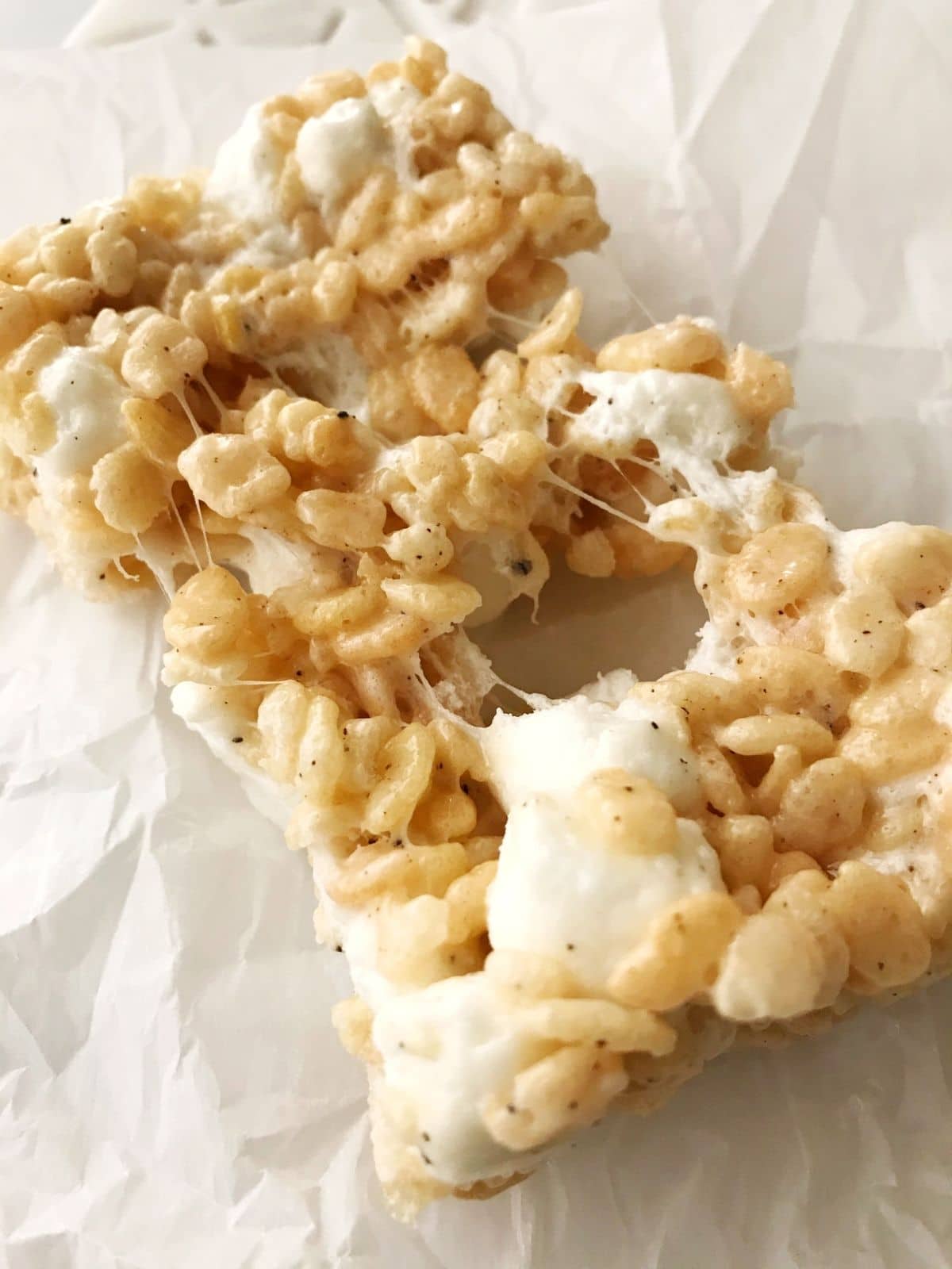 stretching apart a gooey rice krispie treat