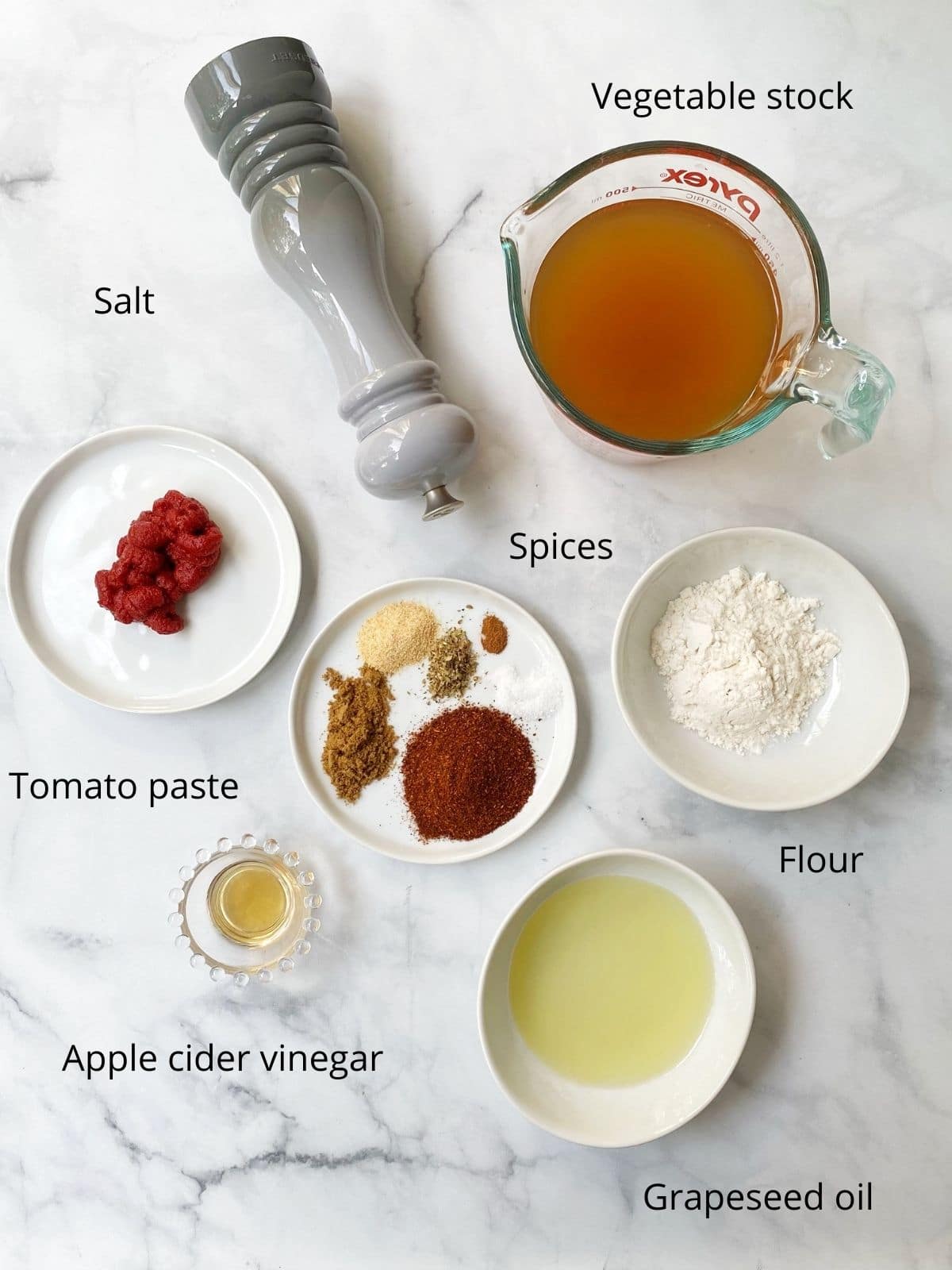 small bowls of broth, spices, flour, oil, tomato paste, vinegar