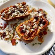 A platter of roasted squash with toppings.