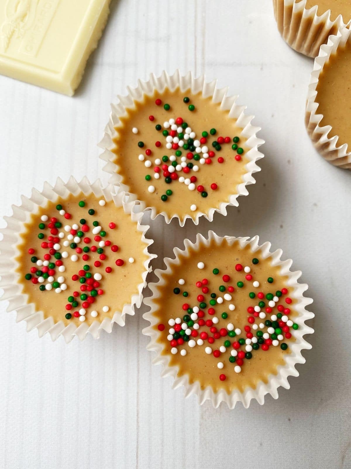 white chocolate peanut butter cups with holiday sprinkles