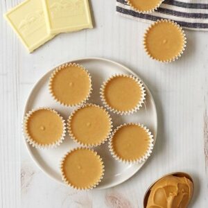 plate of peanut butter cups with a spoonful of peanut butter