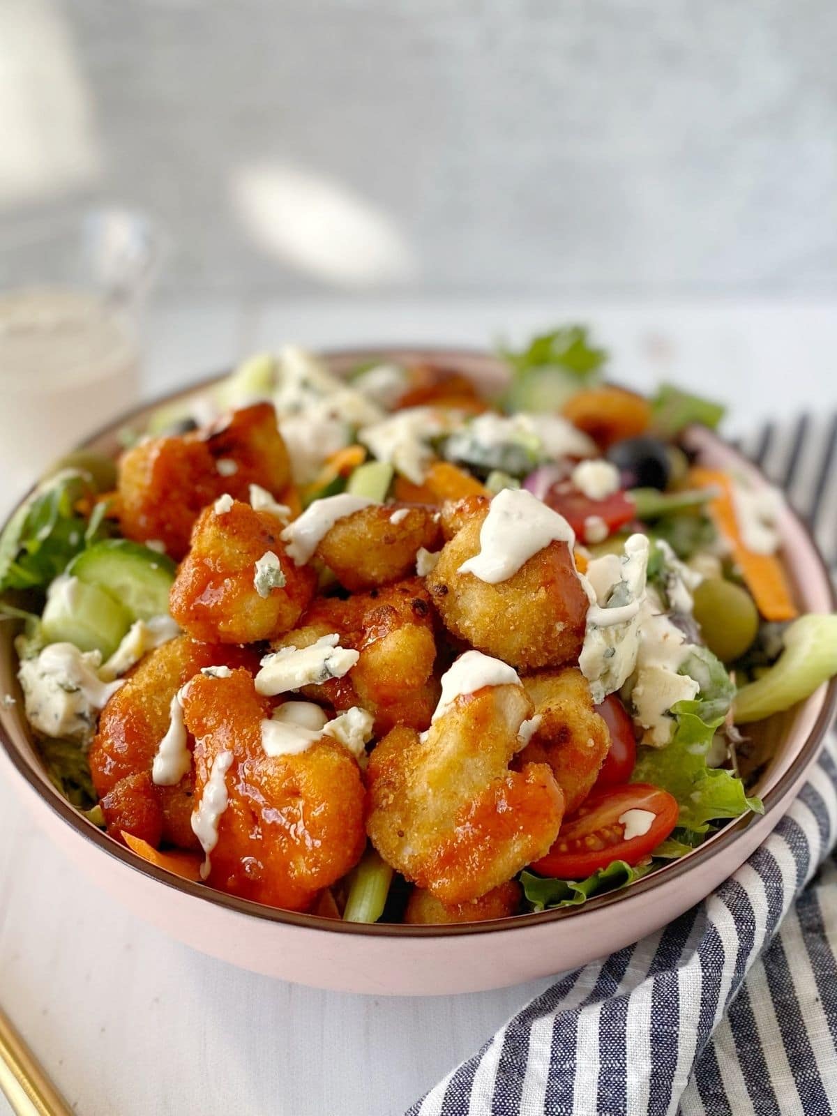 bowl of salad with sunlight streaming in the back