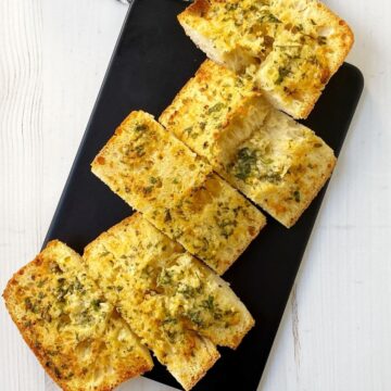 slices of garlic bread on a board