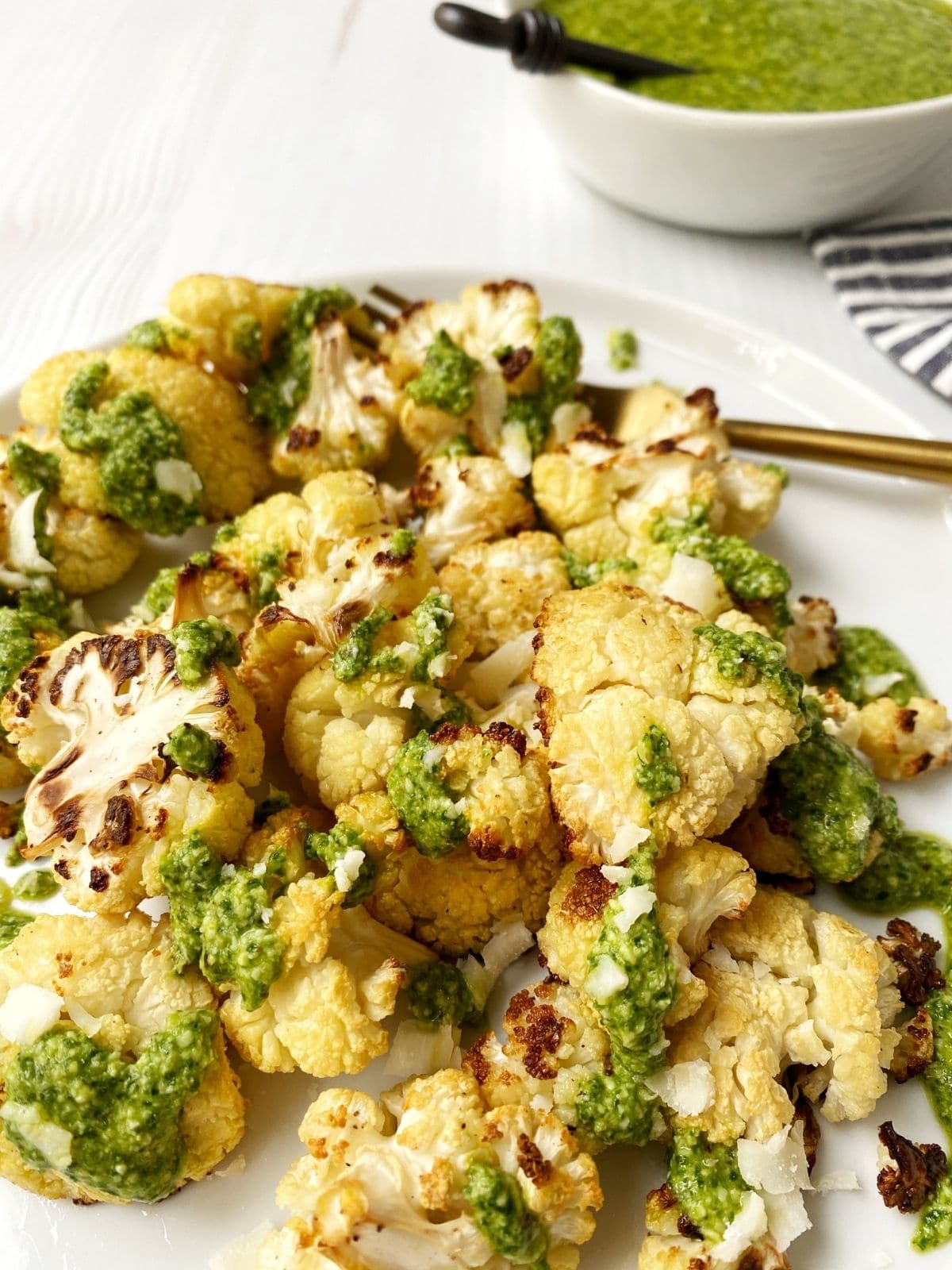 close up of pesto-drizzled cauliflower