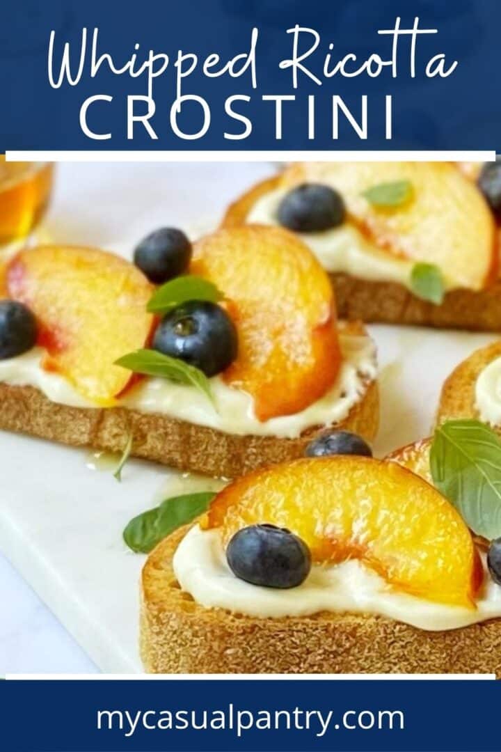 close up of whipped ricotta crostini with peaches.