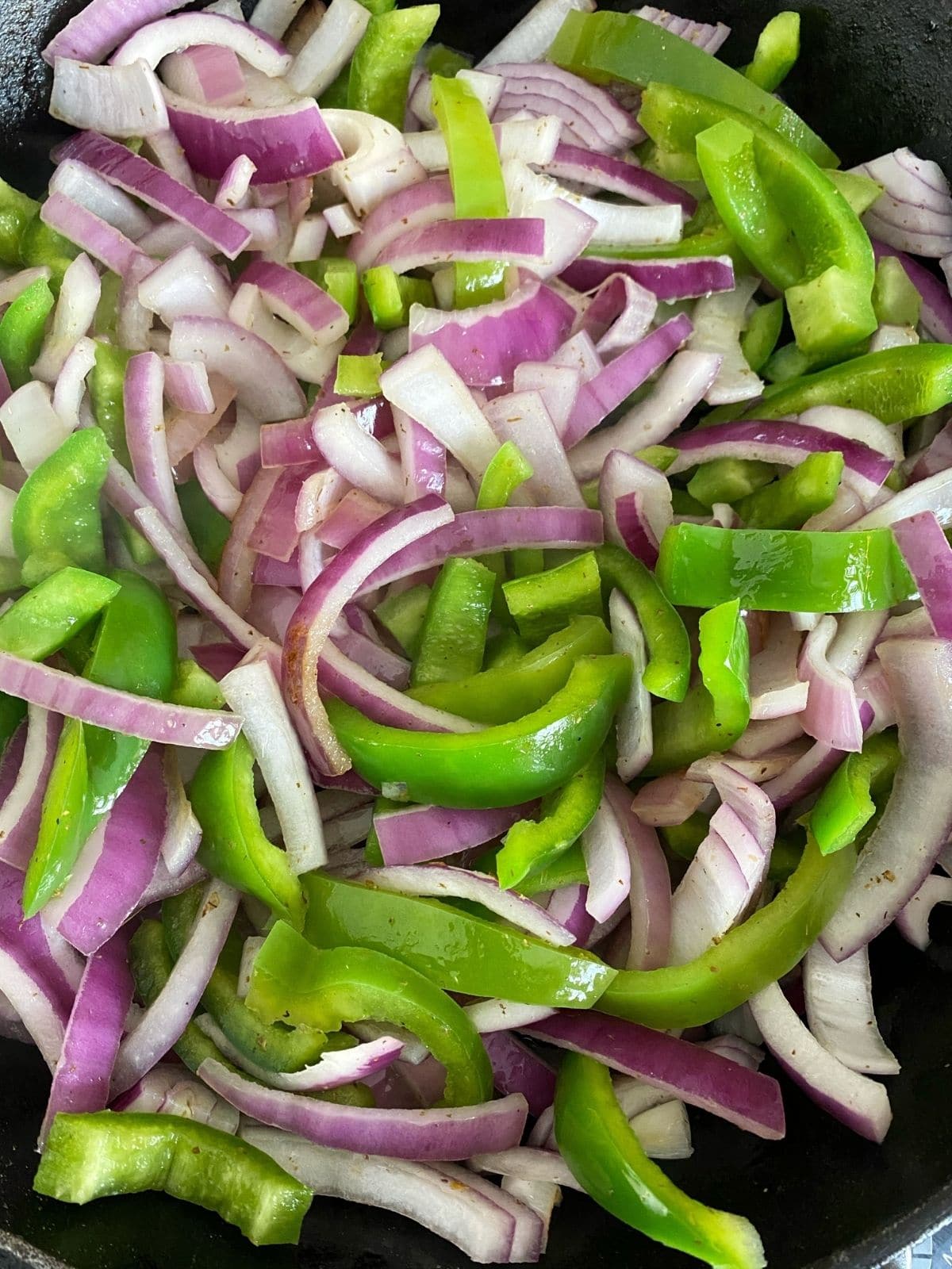 peppers and onions in skillet