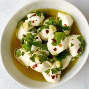 balls of mozzarella in olive oil marinade