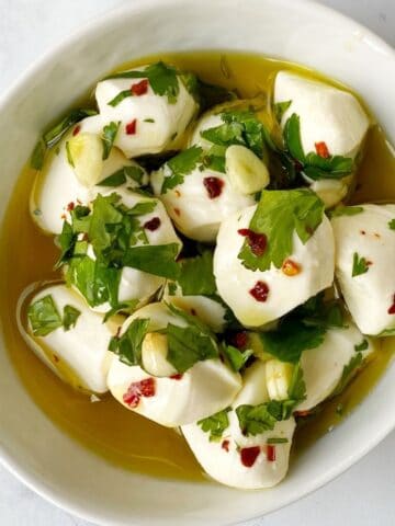 balls of mozzarella in olive oil marinade