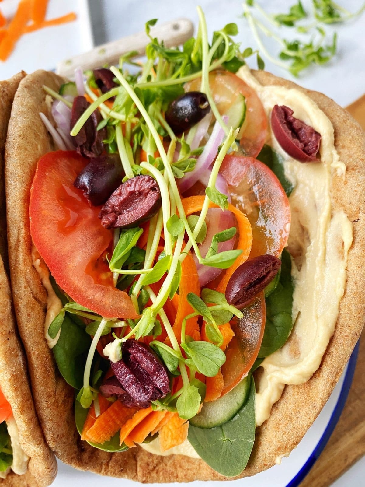 close up of veggie-stuffed pita