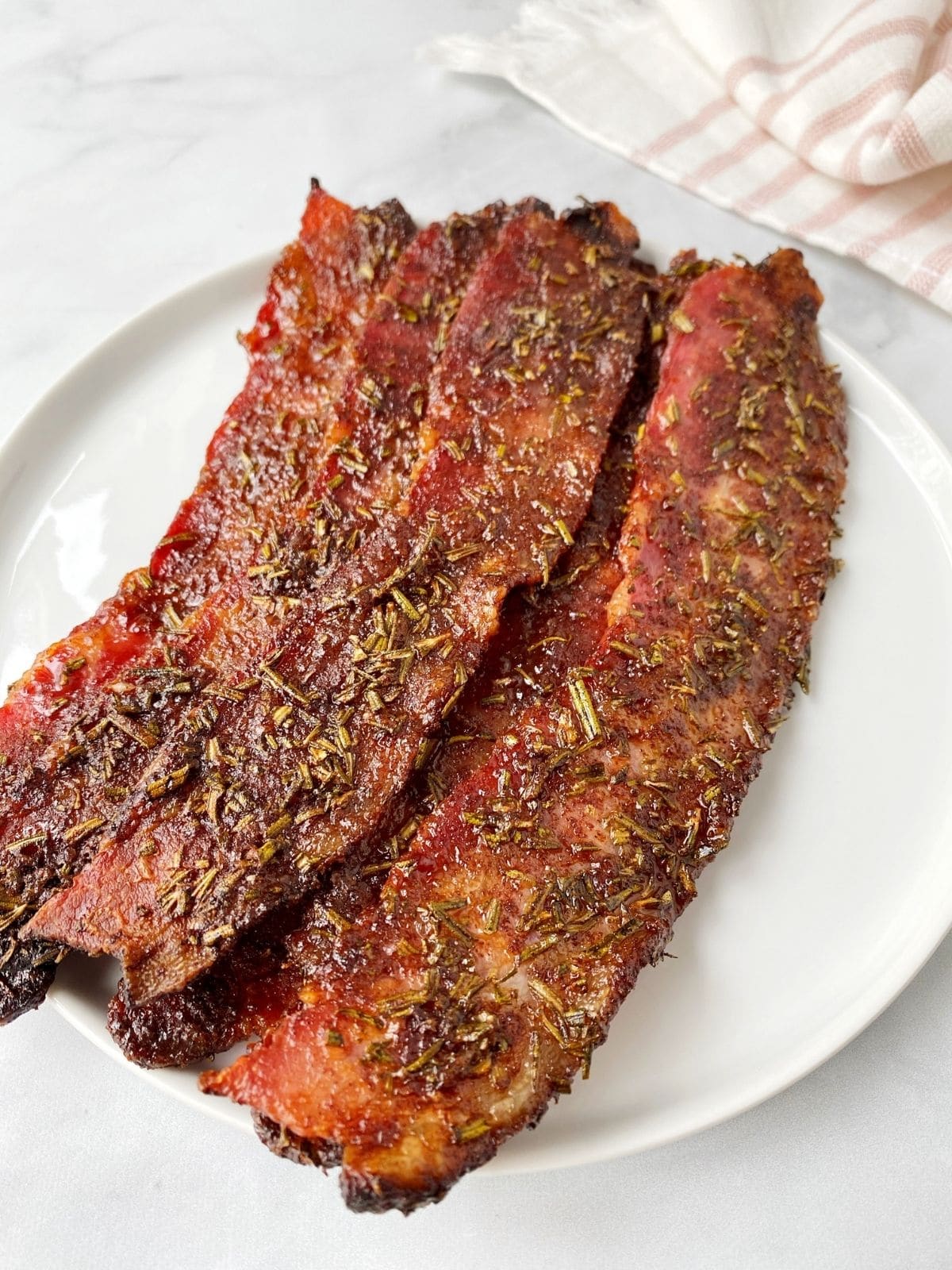herb spiced bacon on a plate