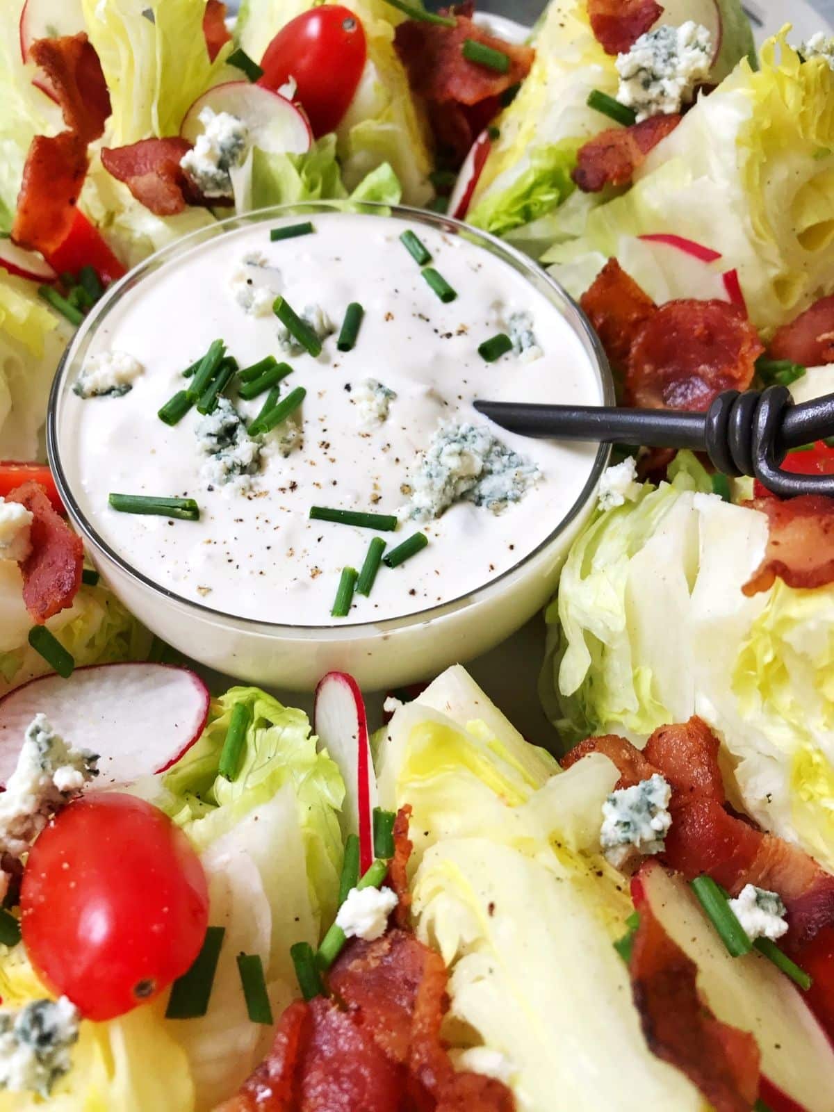 close up of dressing bowl in the middle of the platter