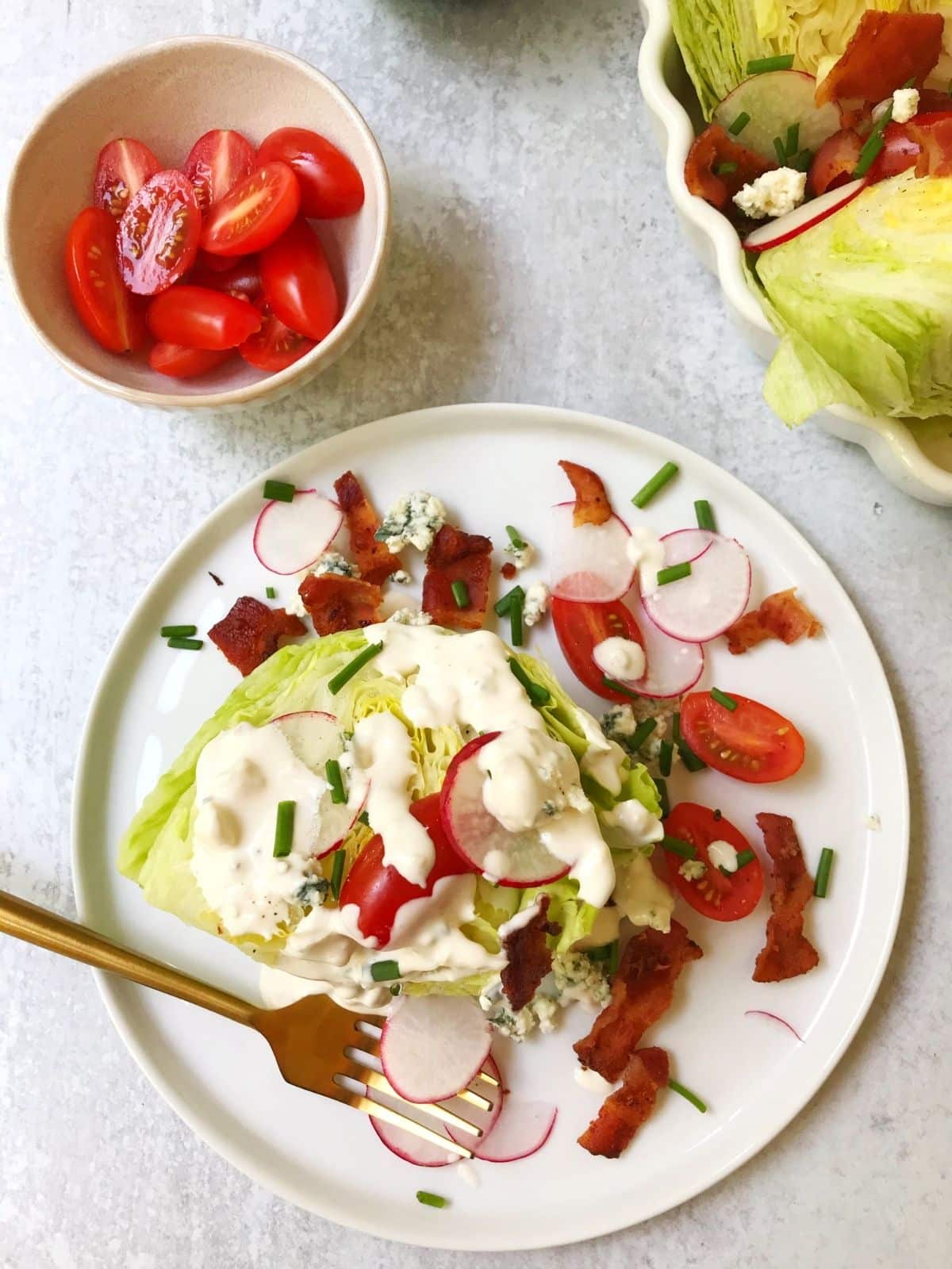 overhead of lettuce wedge on a plate with a fork