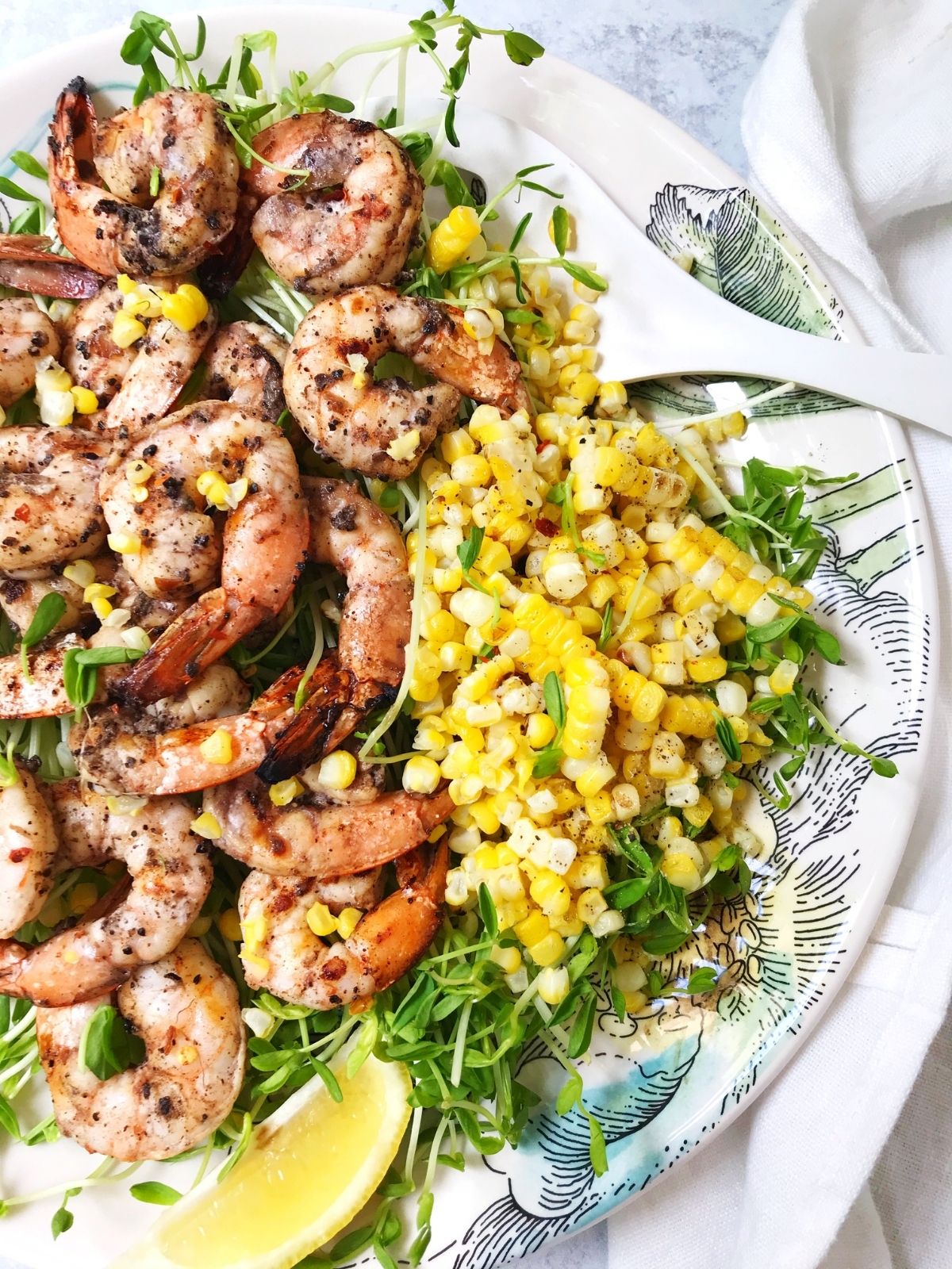 platter of shrimp with corn on the side