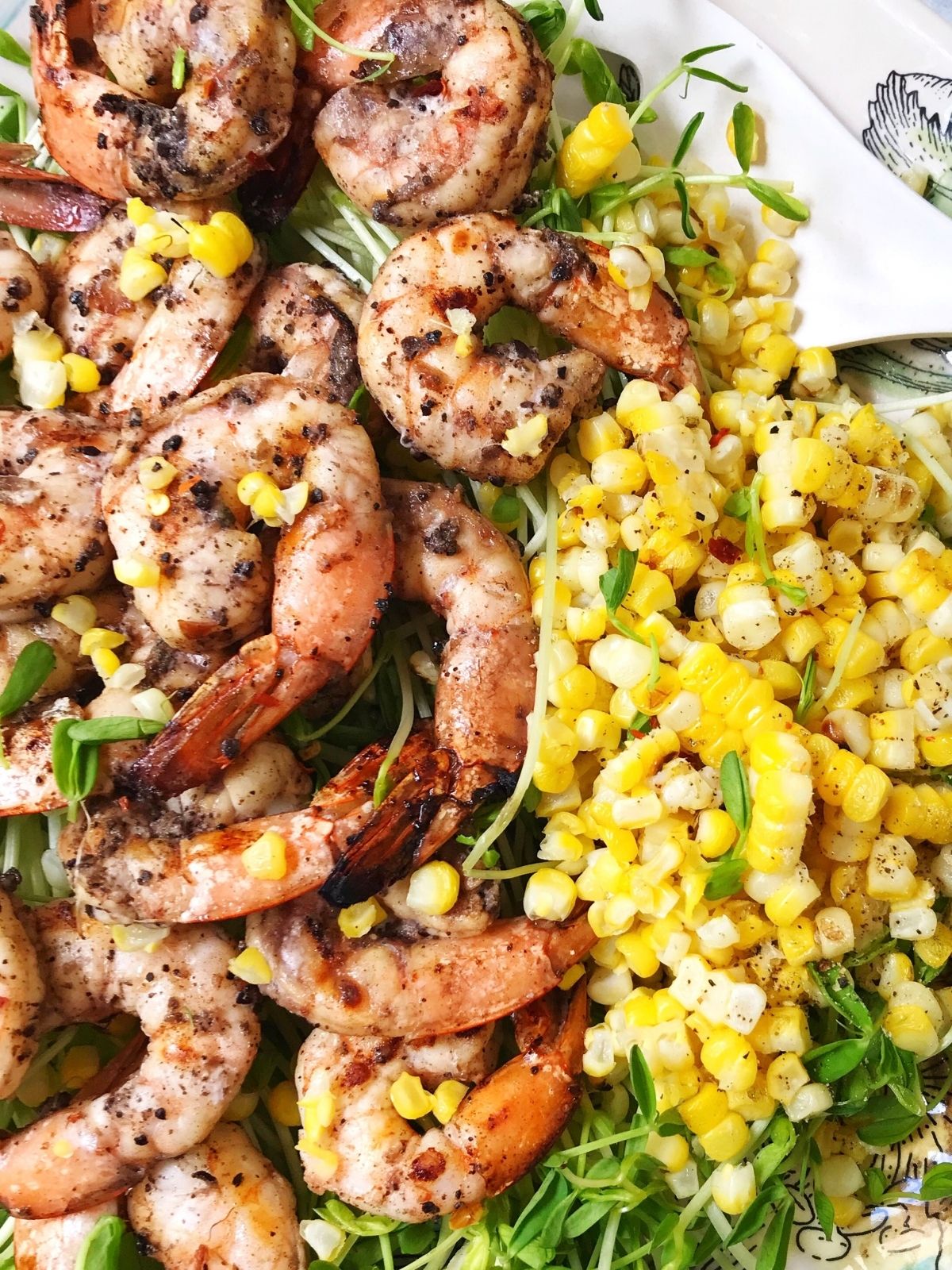 close up of grilled corn with shrimp