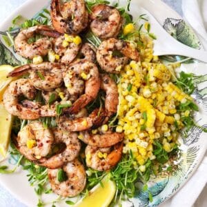 shrimp with grilled corn on a serving plate