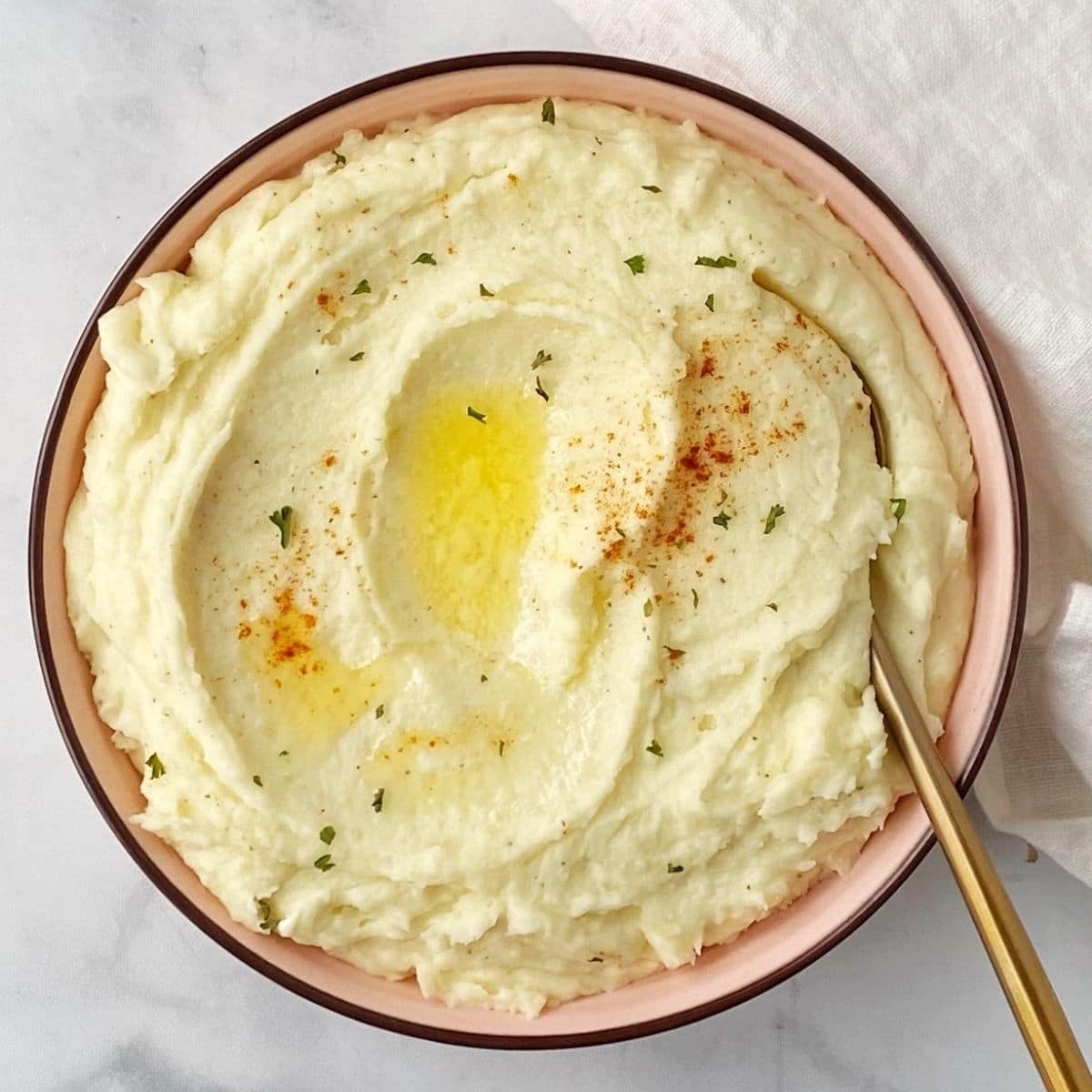 bowl of potatoes with serving spoo