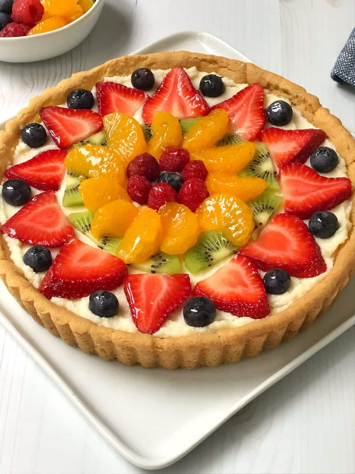 angled view of whole fruit pizza