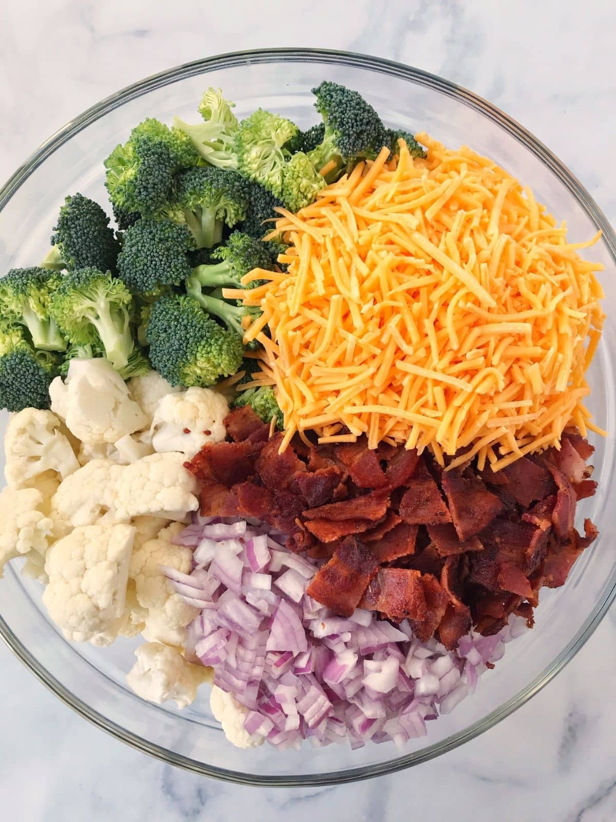 bowl of salad ingredients grouped together before mixing