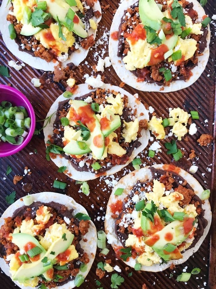 overhead shot of loaded tortillas on a sheet pan