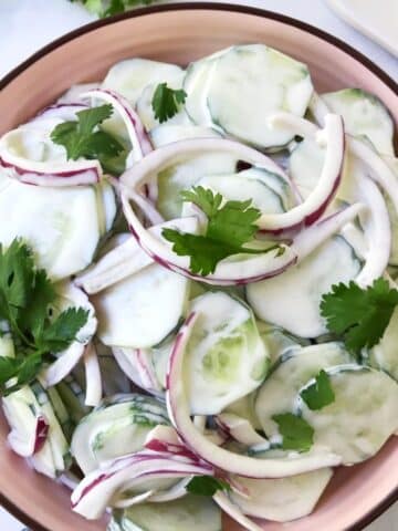 close up of bowl of cucumber salad