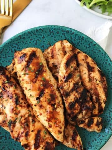 grilled chicken piled on a plate