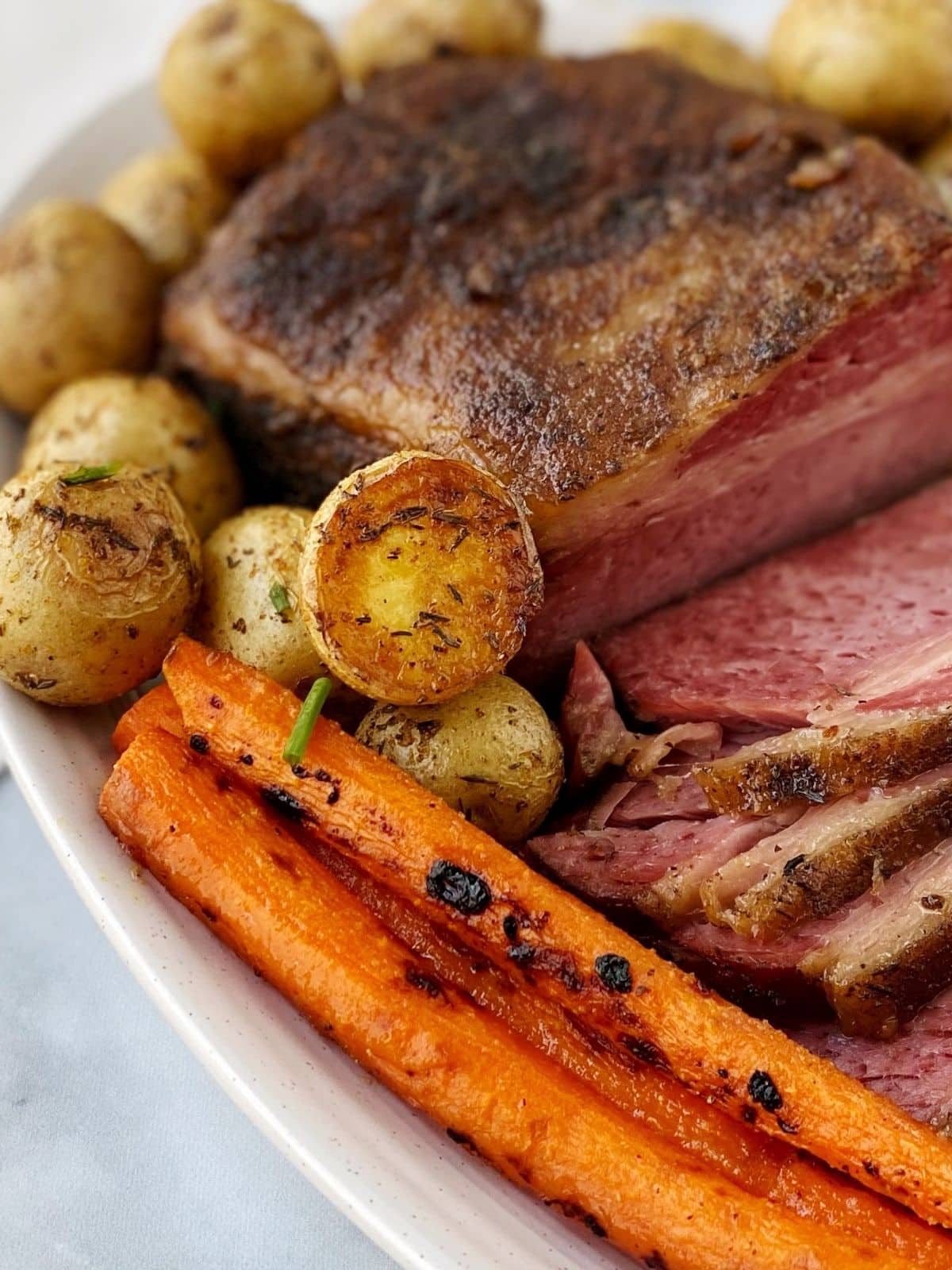 potatoes on a platter with corned beef and carrots