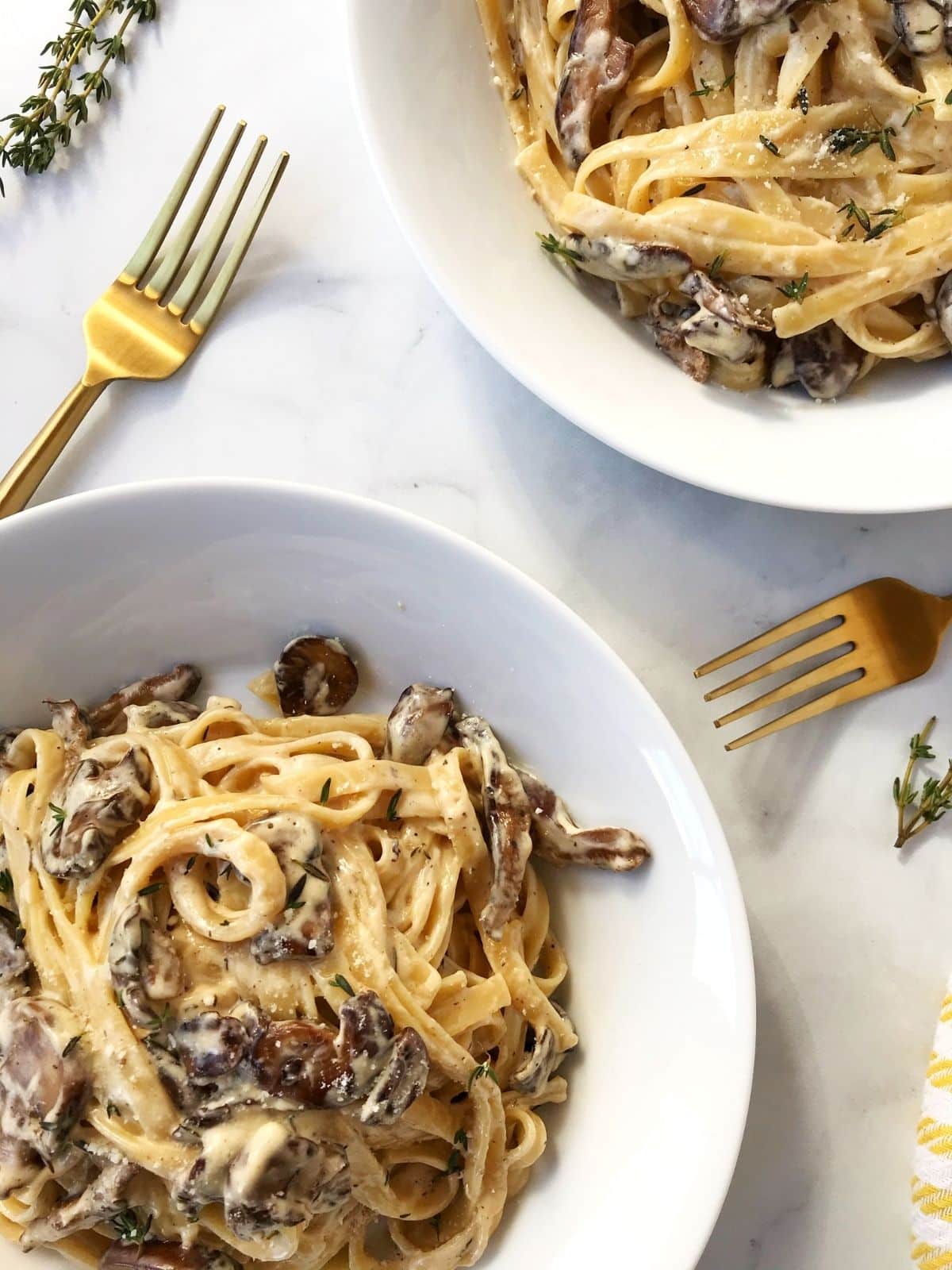 close up of two bowls of pasta