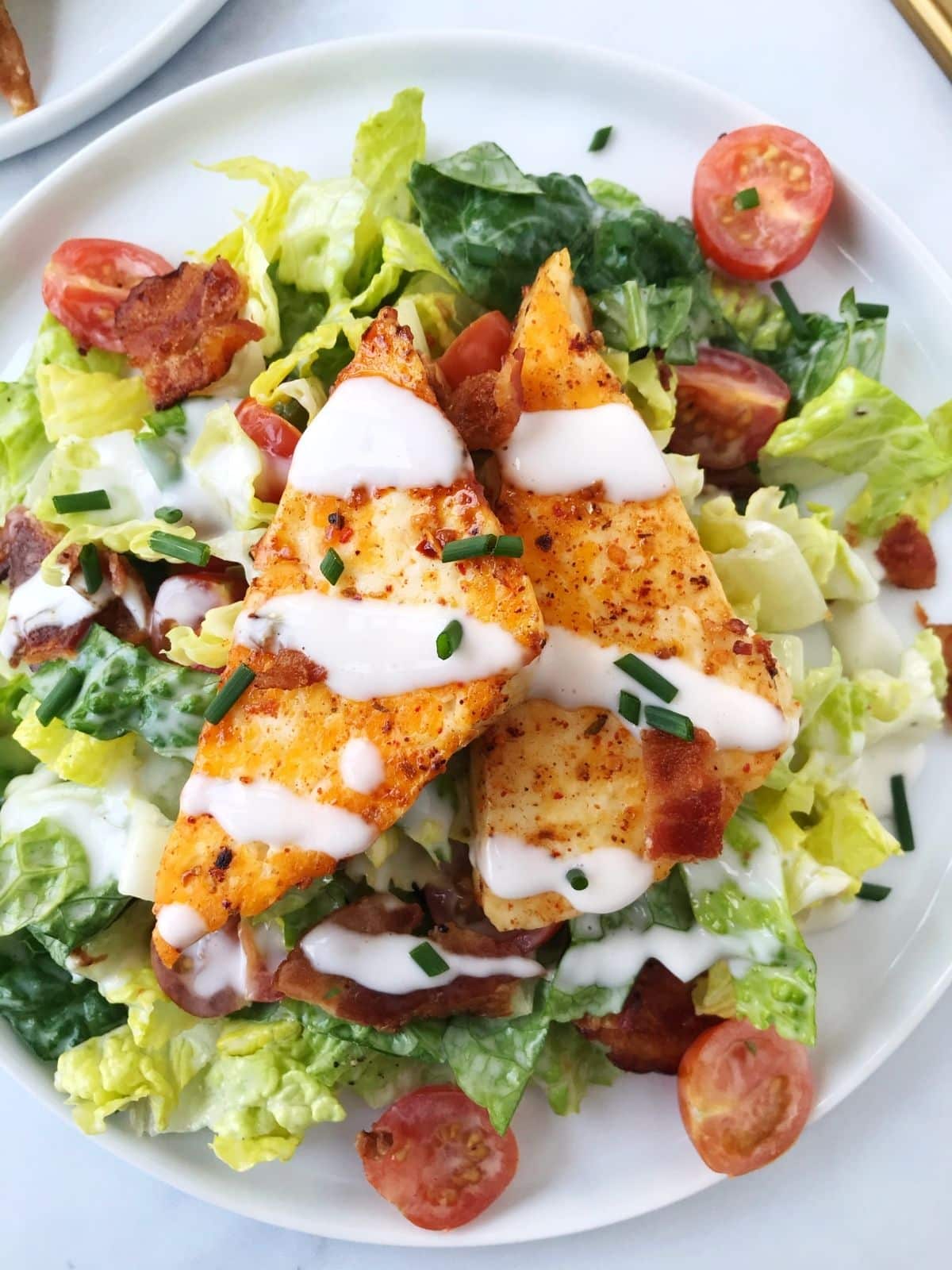 plate of BLT salad topped with hallouimi