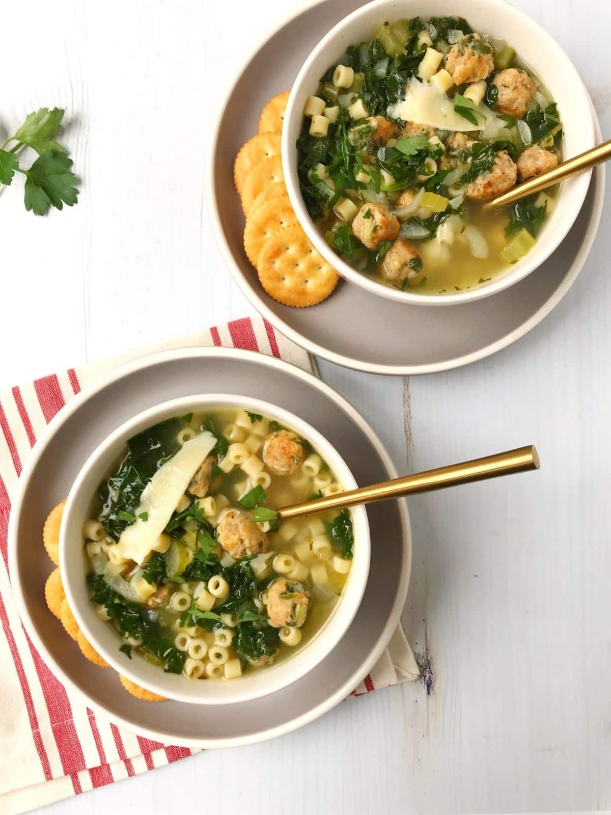 two bowls of soup with crackers