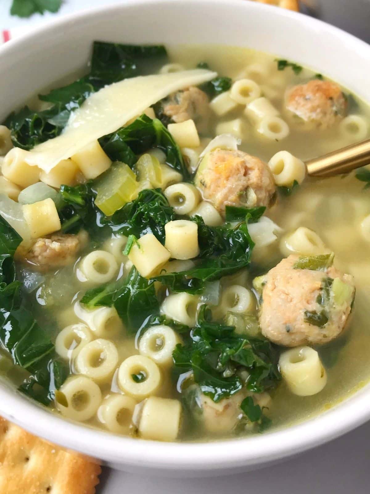 angled view of a bowl of soup with crackers