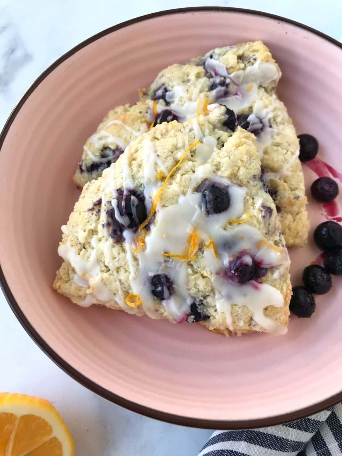 overhead shot of glazed scones in a dish