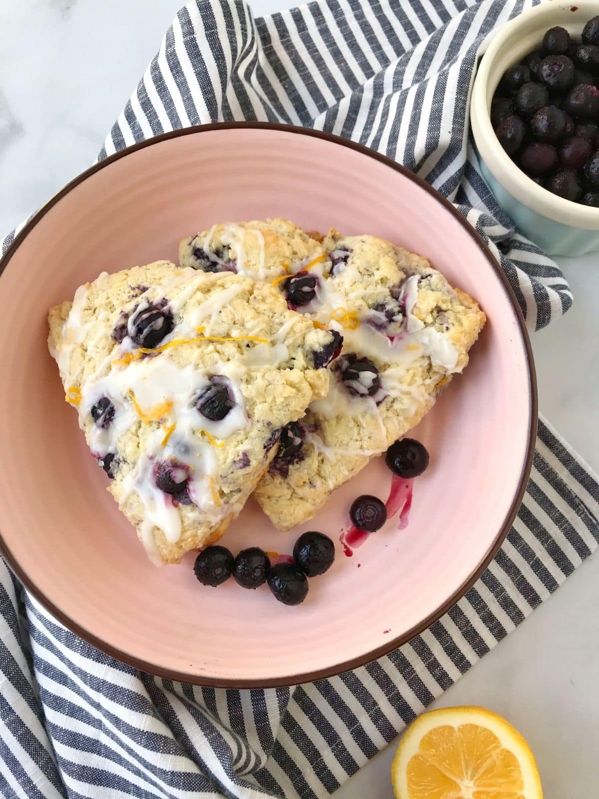 scones in a dish garnished with blueberries