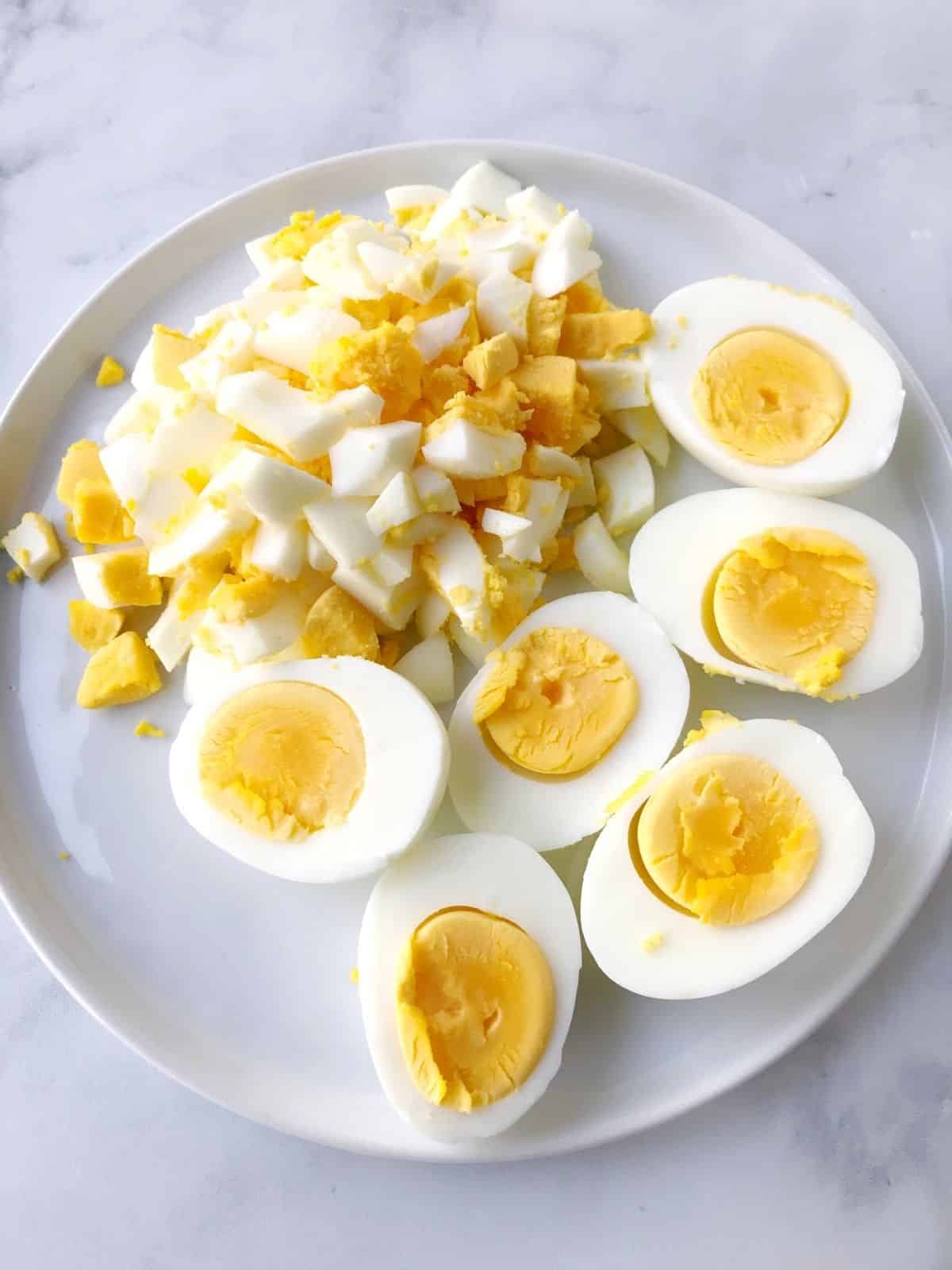 hard boiled eggs, some halved and some chopped