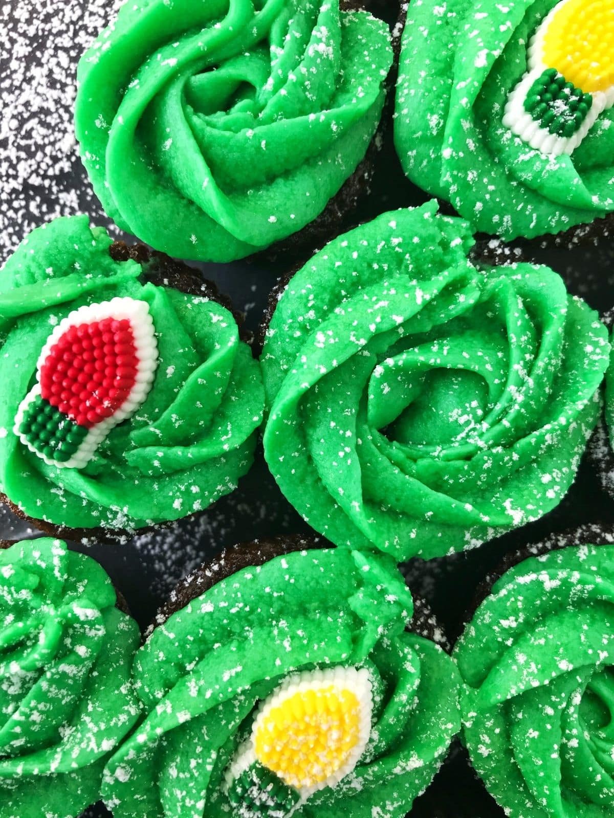 close up of cupcakes with green frosting