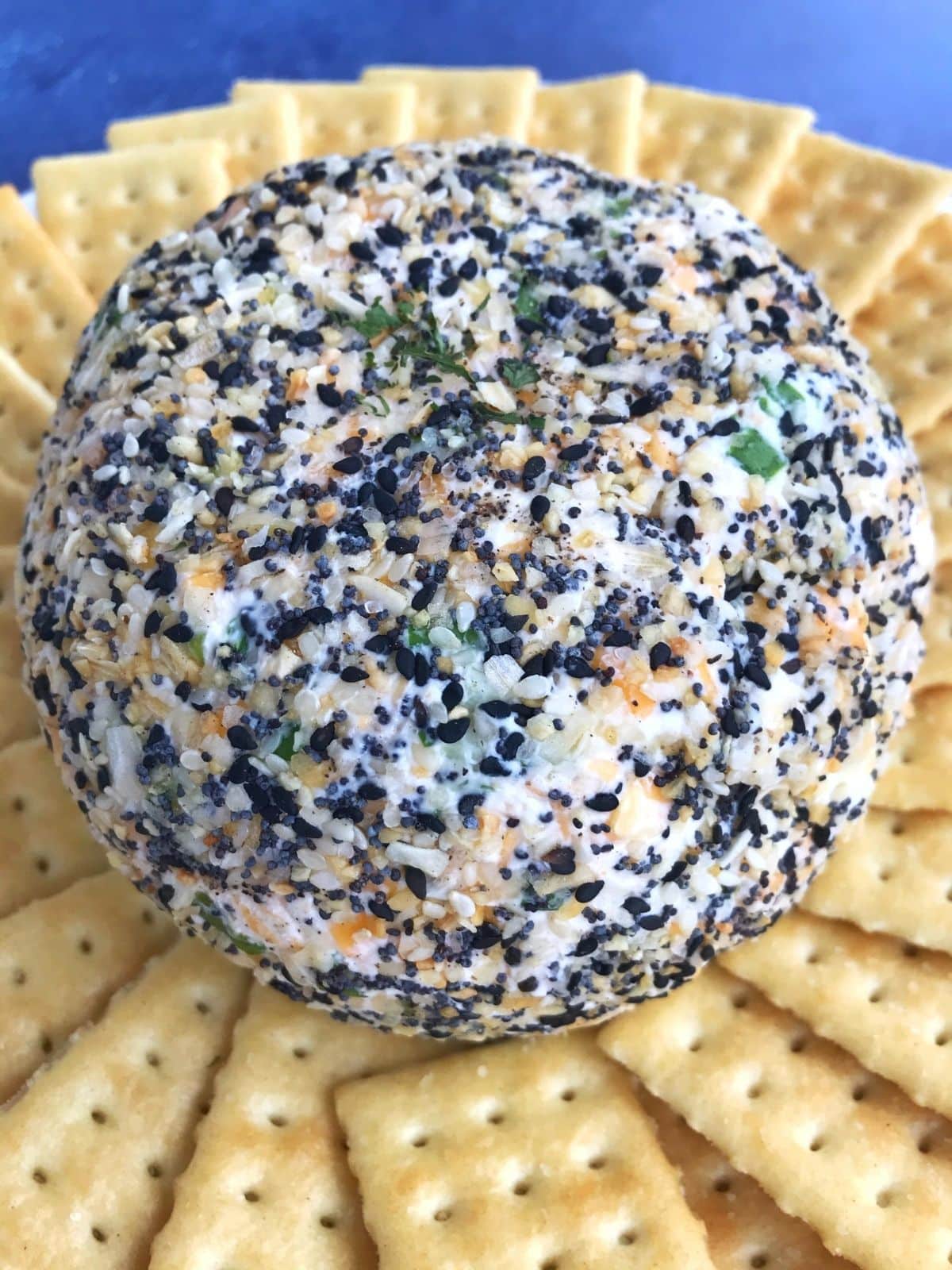 overhead of cheese ball with crackers