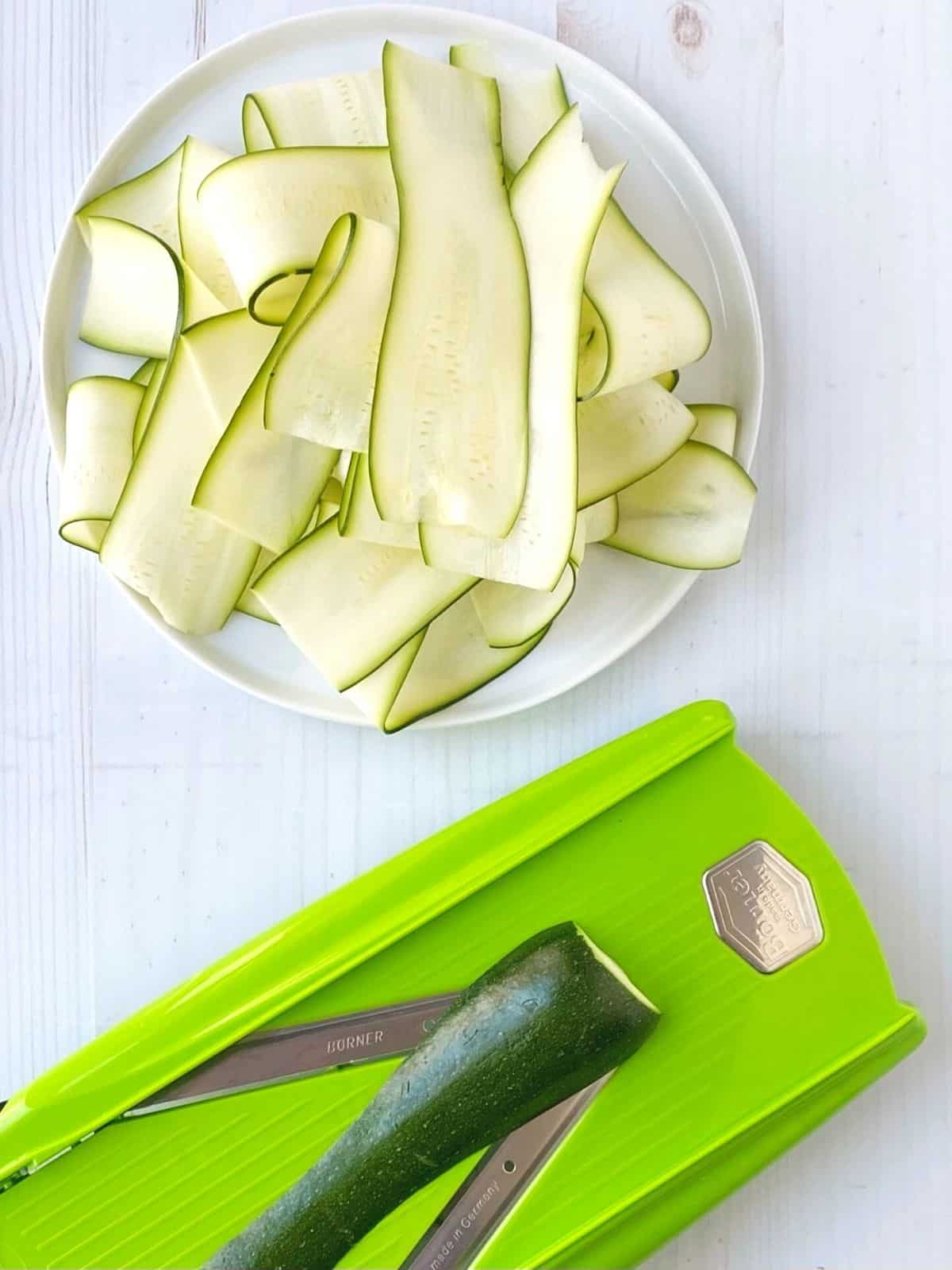 mandolin and zucchini ribbons on a plate