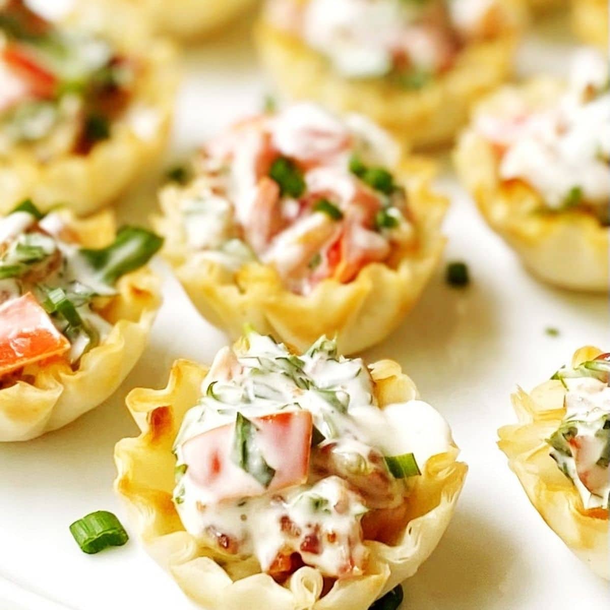 close up of BLT cups on a white platter