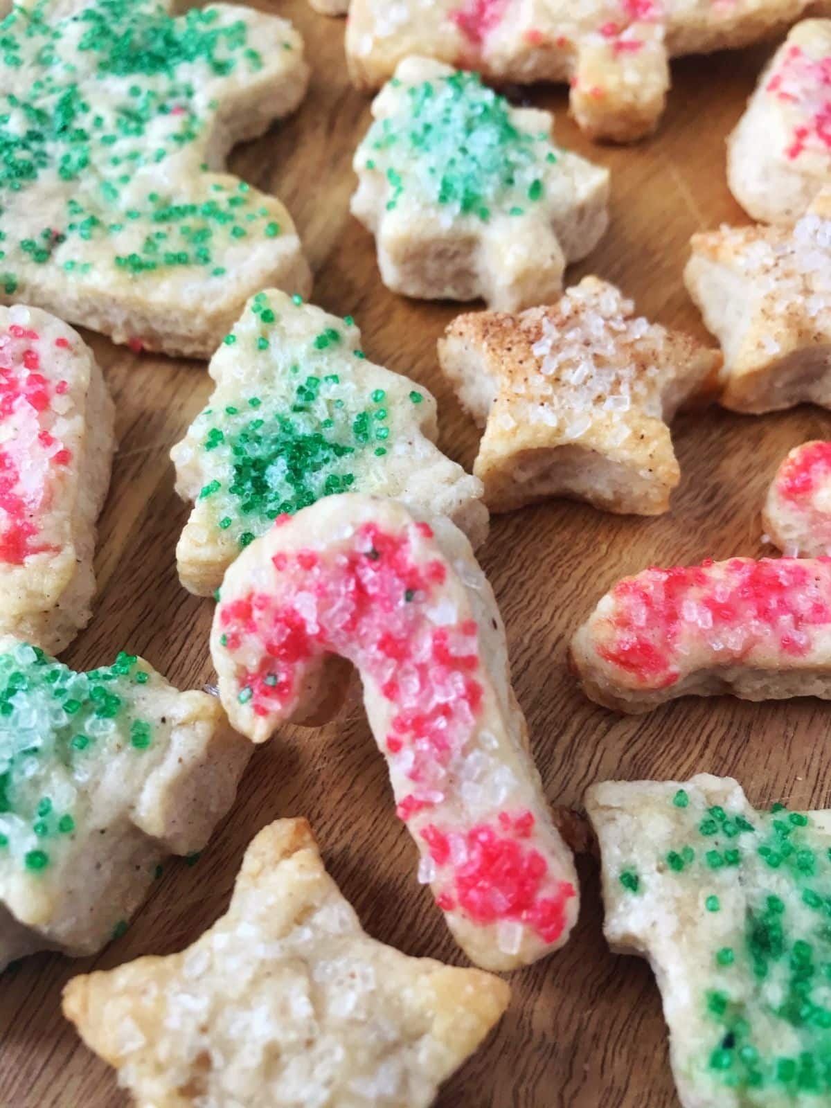 close up of candy cane cookie with red sprinkles