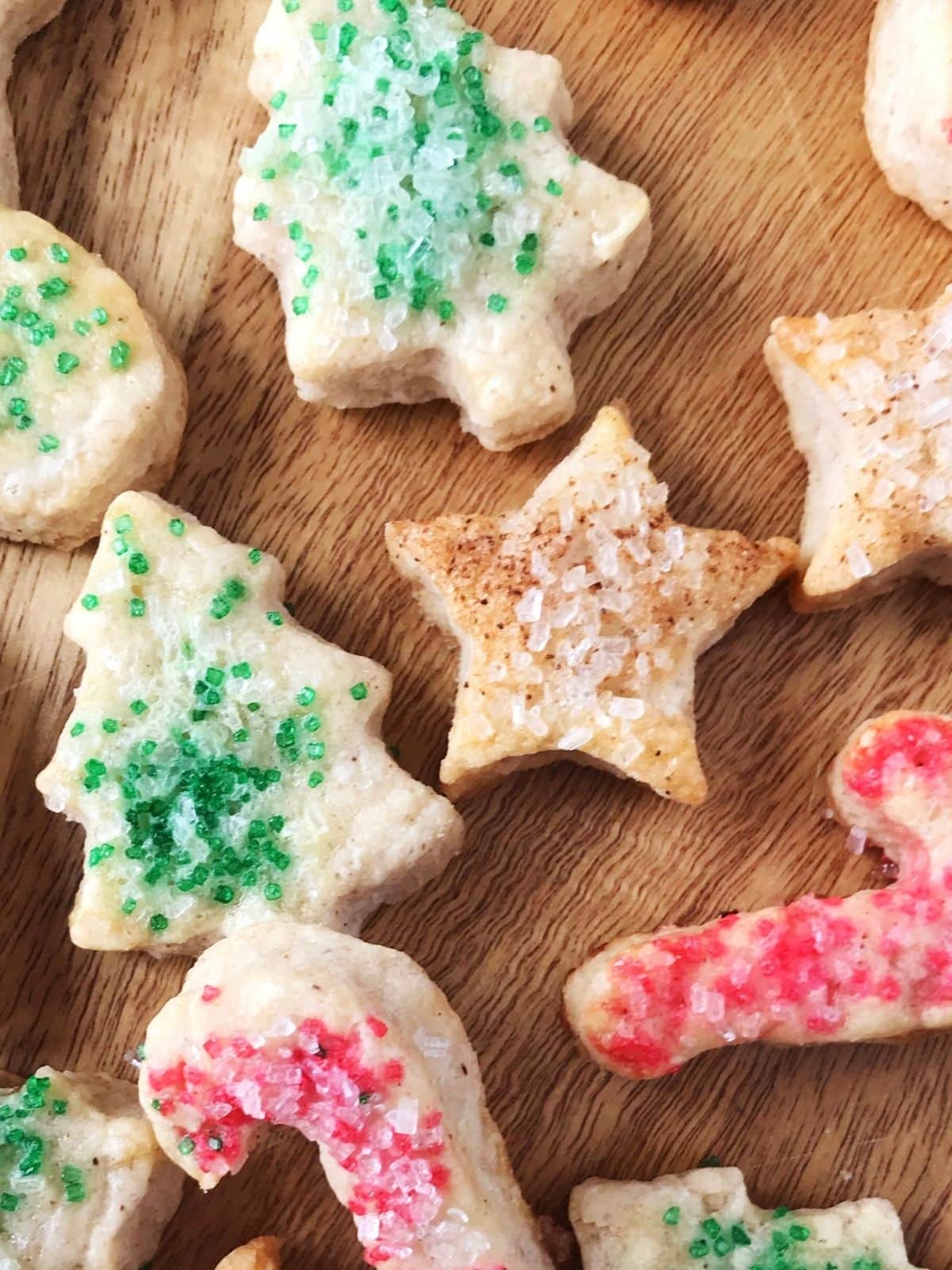 close up of candy cane, star, and tree-shaped cookies