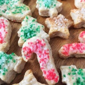 close up of candy cane cookie with red sprinkles