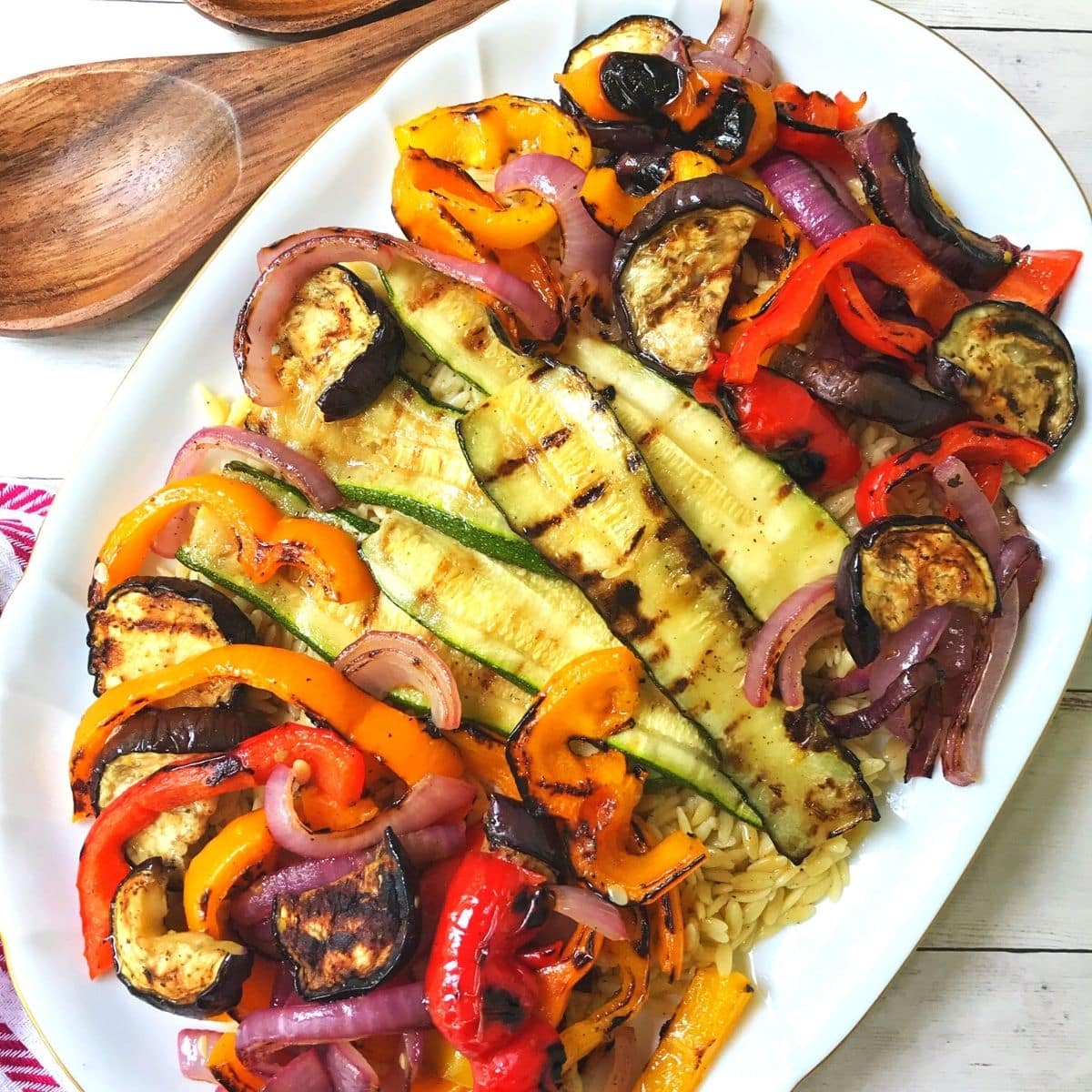 orzo with grilled vegetables on a platter.